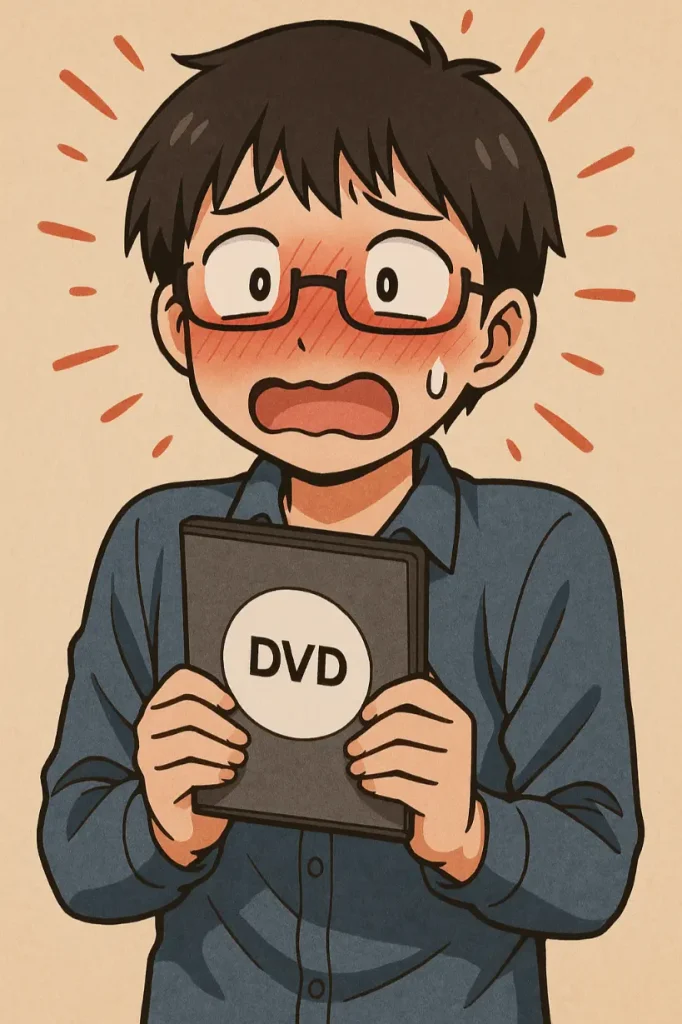 アダルトDVDを手に持って恥ずかしがっている男性